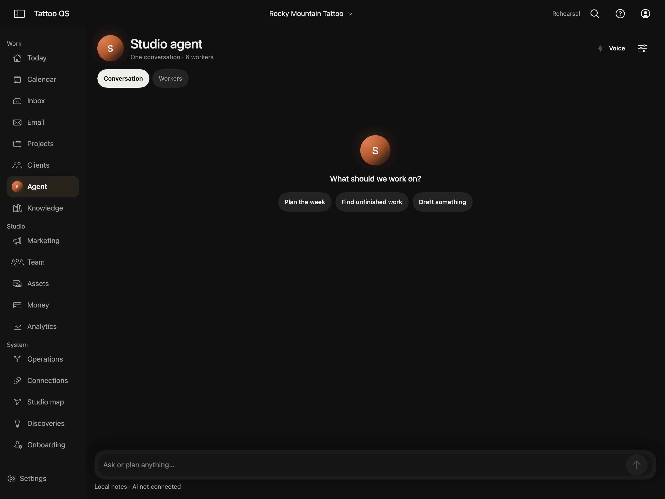 The current Tattoo OS prototype: a matte dark studio workspace with Studio agent conversation, sidebar and composer